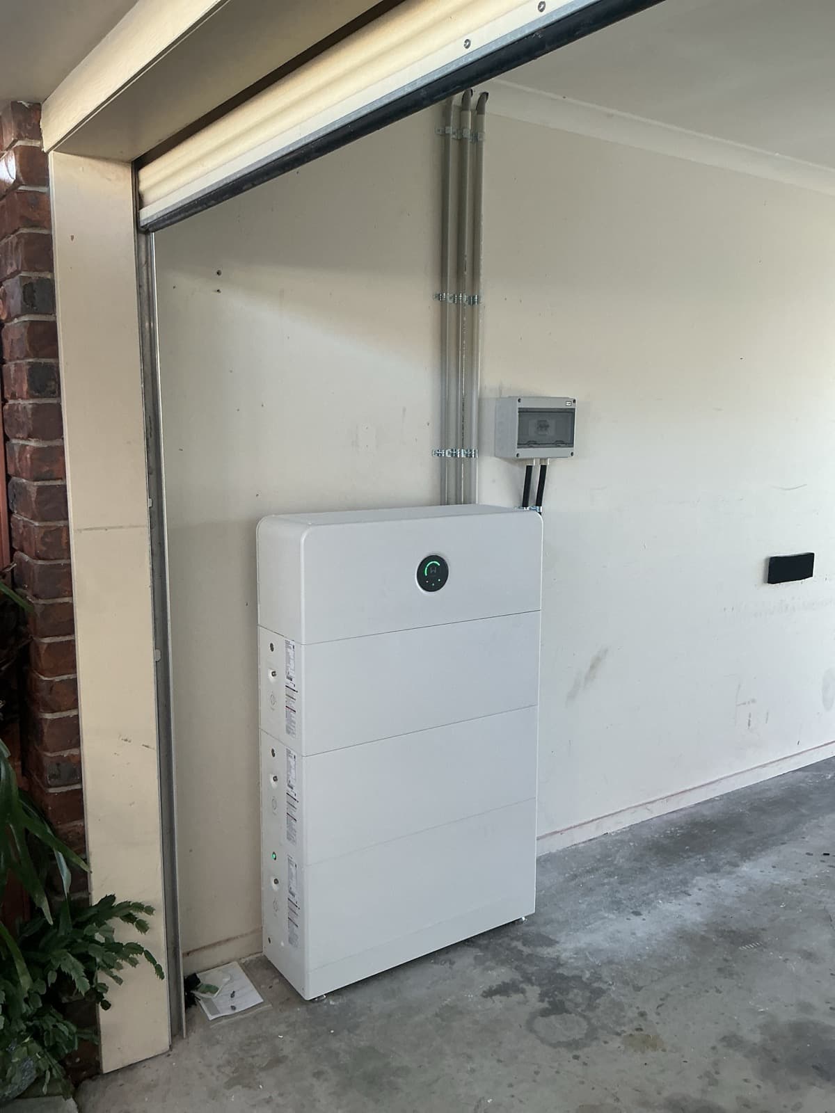 Modular home battery installed in a garage